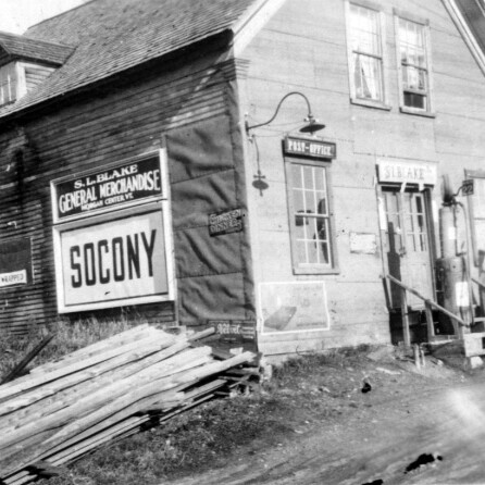 Photograph of a building with a billboard on its side