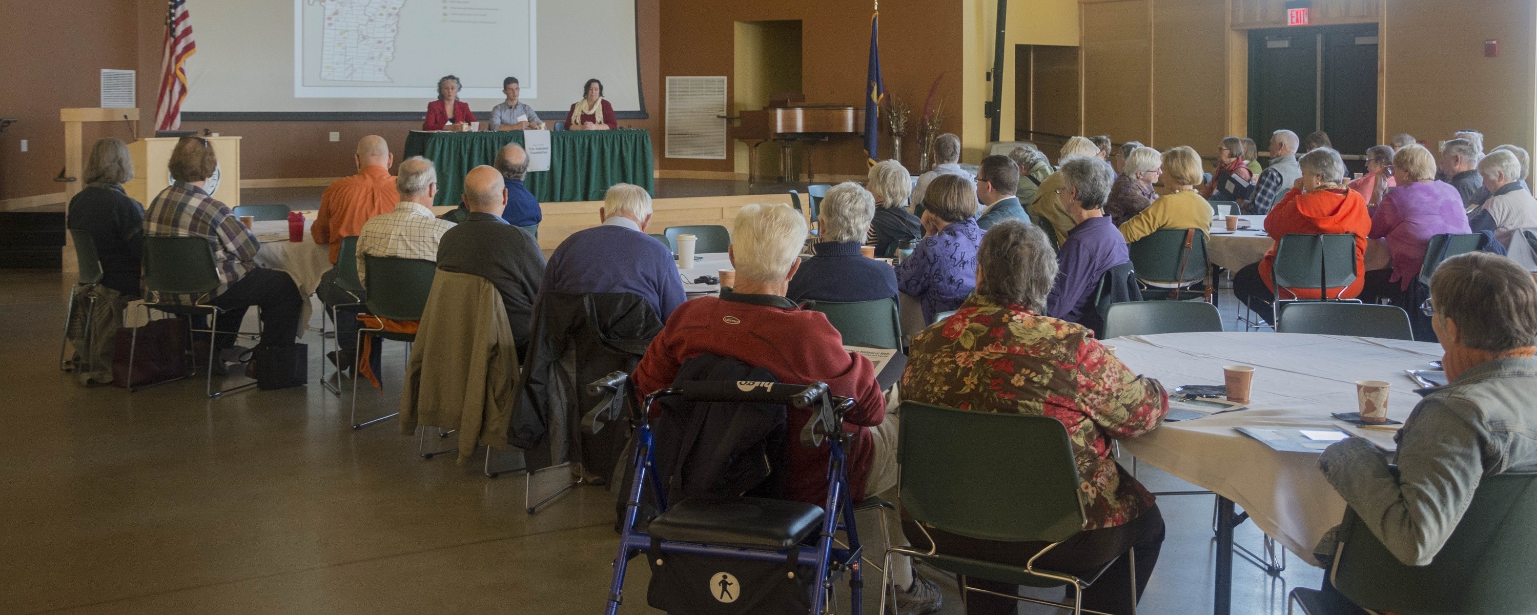 large group of people sitting at tables