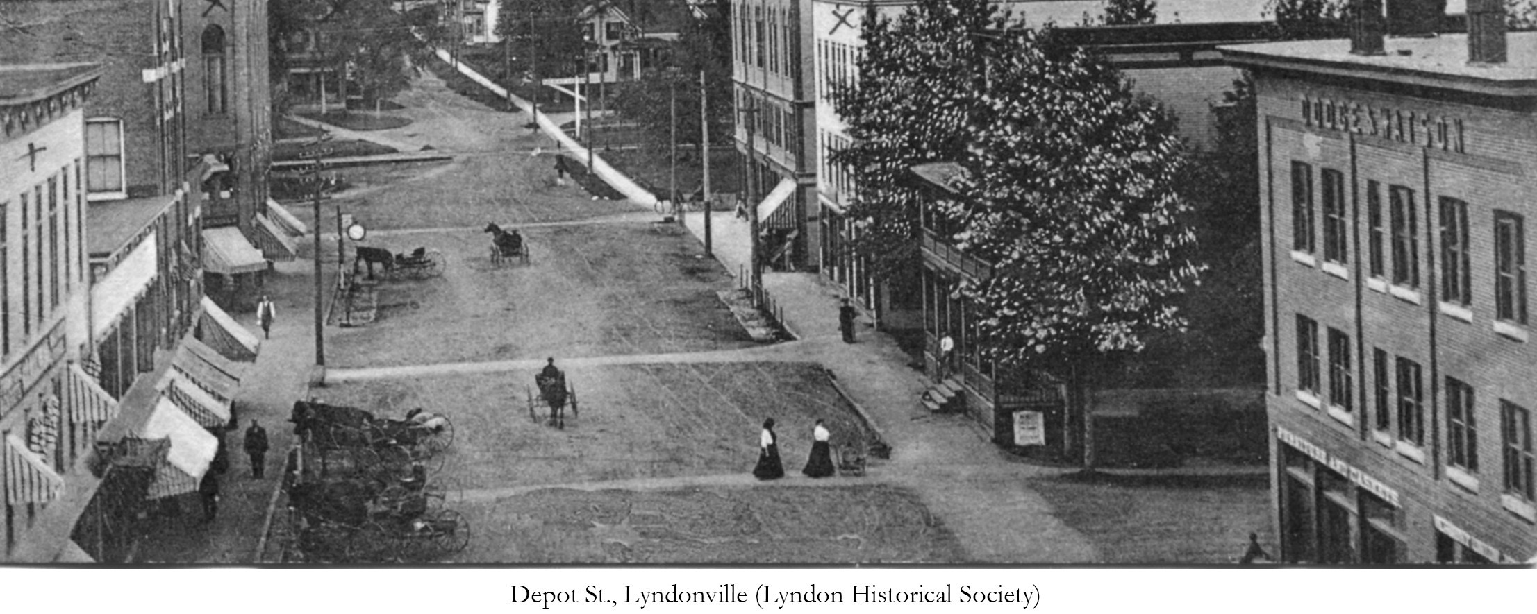 black and white photo of street and buildings